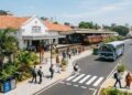 Modernised public infrastructure in Sri Lanka with a renovated railway station, public transport, clean streets, tropical greenery and local and foreign residents using the facilities as part of the Clean Sri Lanka programme.