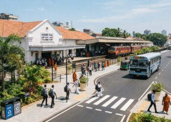 Modernised public infrastructure in Sri Lanka with a renovated railway station, public transport, clean streets, tropical greenery and local and foreign residents using the facilities as part of the Clean Sri Lanka programme.
