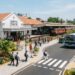 Modernised public infrastructure in Sri Lanka with a renovated railway station, public transport, clean streets, tropical greenery and local and foreign residents using the facilities as part of the Clean Sri Lanka programme.