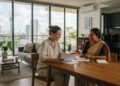 Expat viewing a modern furnished apartment in Colombo, Sri Lanka, with a local property agent.
