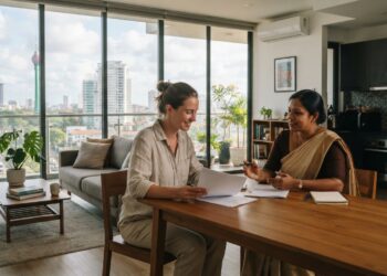 Expat viewing a modern furnished apartment in Colombo, Sri Lanka, with a local property agent.